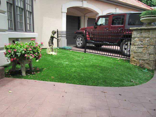 Artificial landscape grass next to the front walkway in Missouri