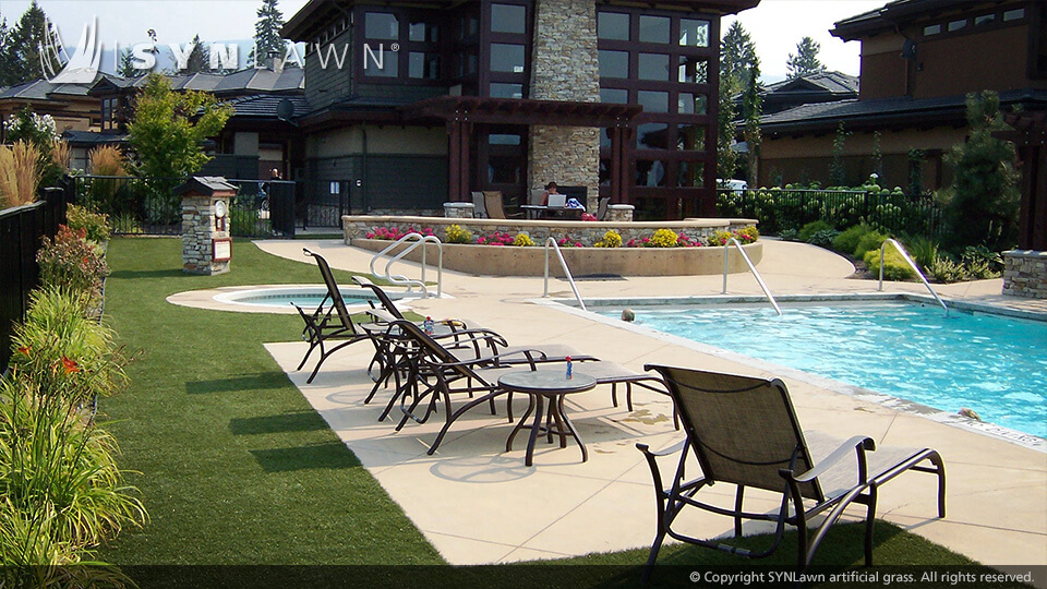 Hotel swimming pool surrounded by artificial turf patio in Missouri