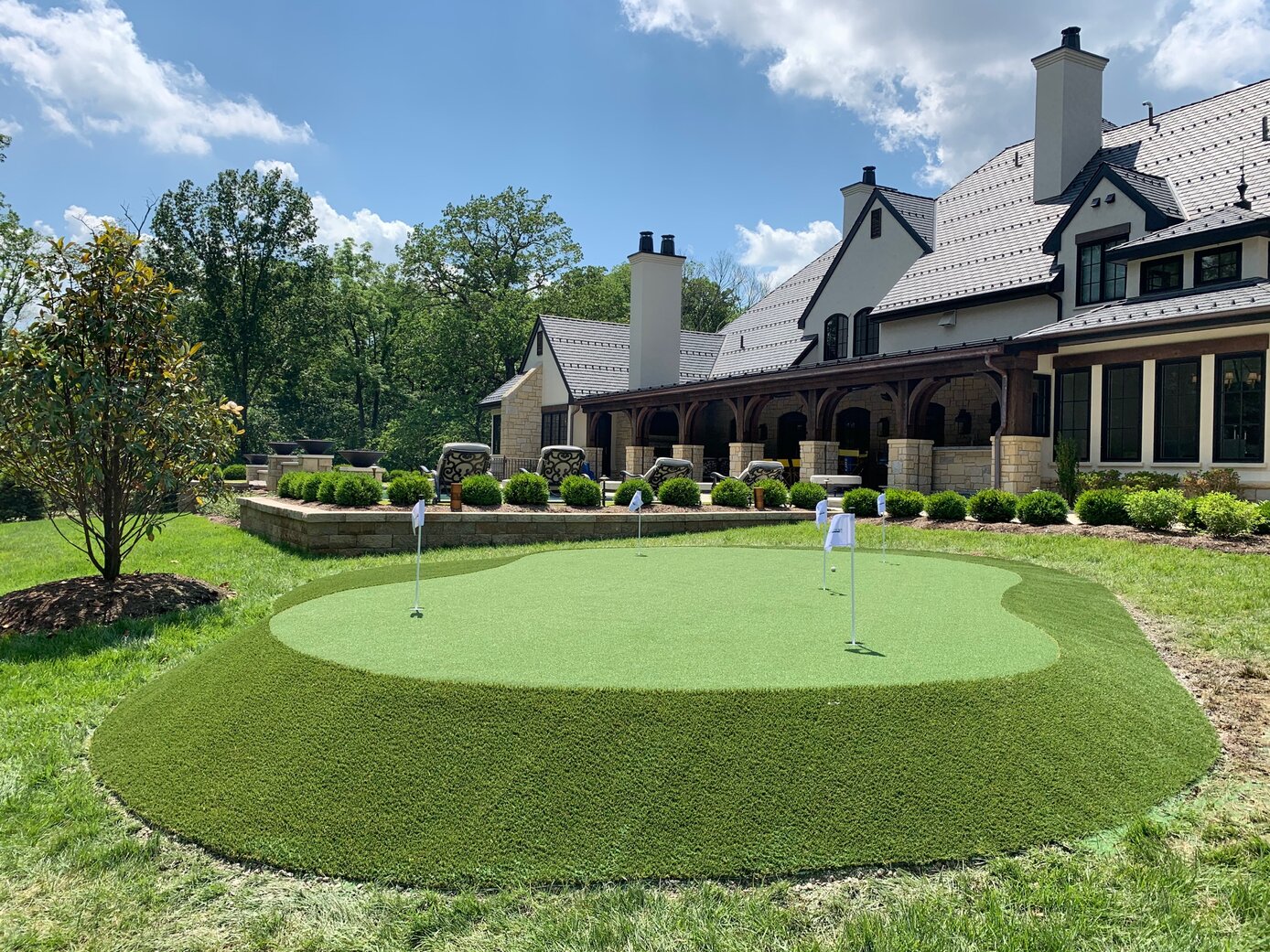 a golf putting green in an apartment complex