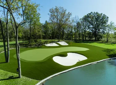 Artificial grass golf course hole with sand trap